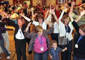 NHF attendees do their version of the YMCA on the dance floor.